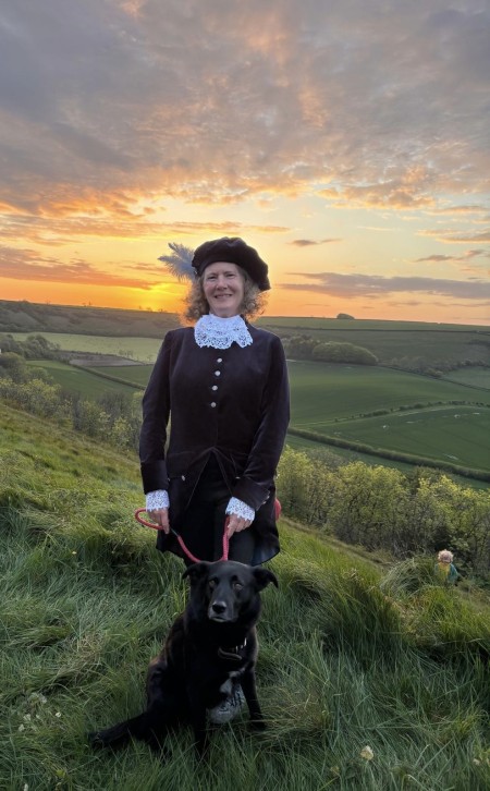 High Sheriff of Dorset, Helena Conibear with her dog against a beautiful sunset